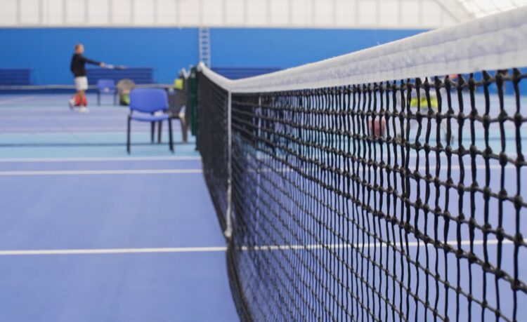 Lowering Of Tennis Net At The Center